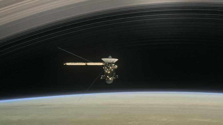 Illustration of Cassini diving between Saturn and its innermost rings as part of the mission's Grand Finale